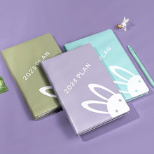 Load image into Gallery viewer, Playful Bunny 2023 (A5) Leather Planners (4 Colors)