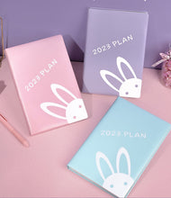 Load image into Gallery viewer, Playful Bunny 2023 (A5) Leather Planners (4 Colors)