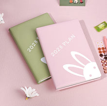 Load image into Gallery viewer, Playful Bunny 2023 (A5) Leather Planners (4 Colors)